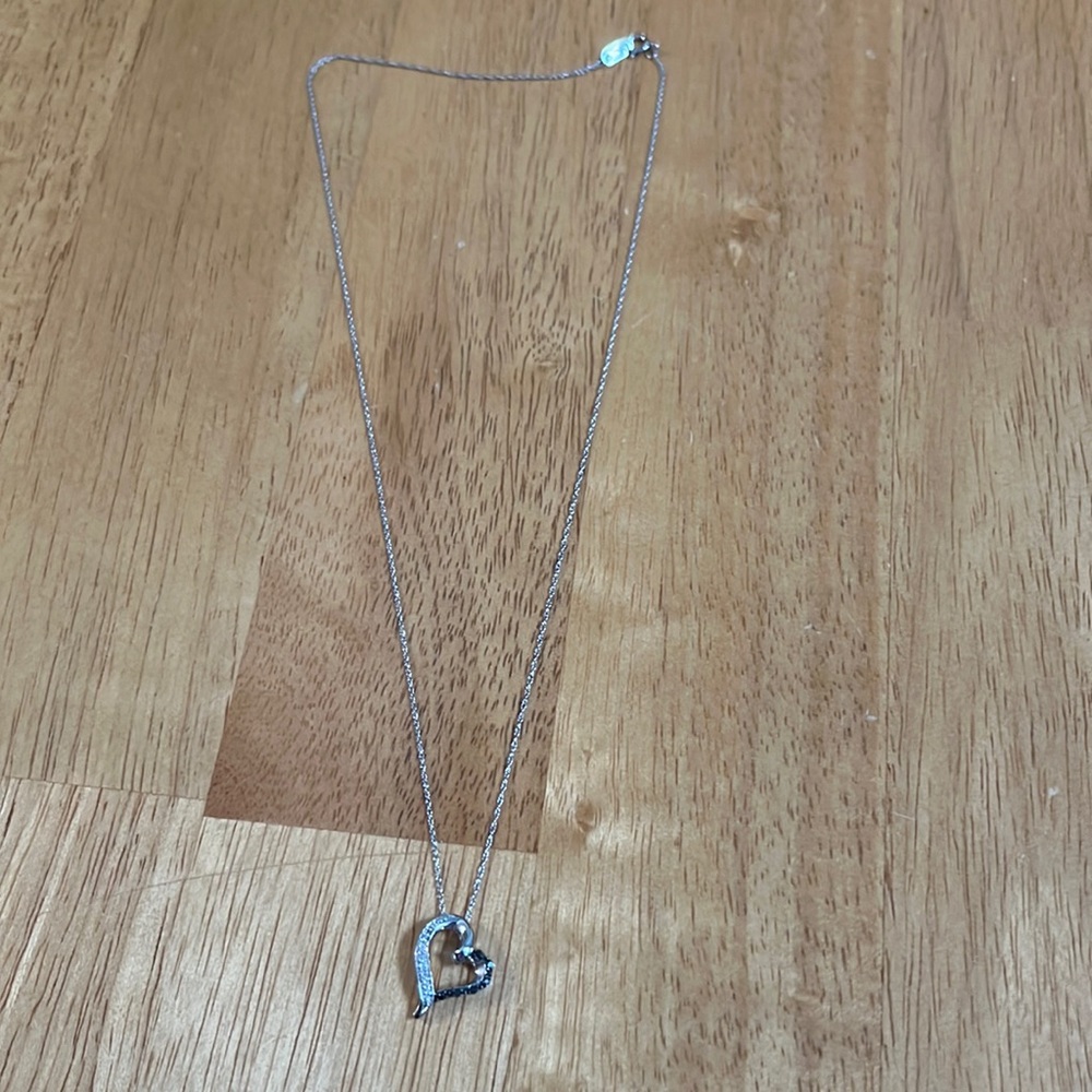 White gold necklace with heart emblem stamped 10K